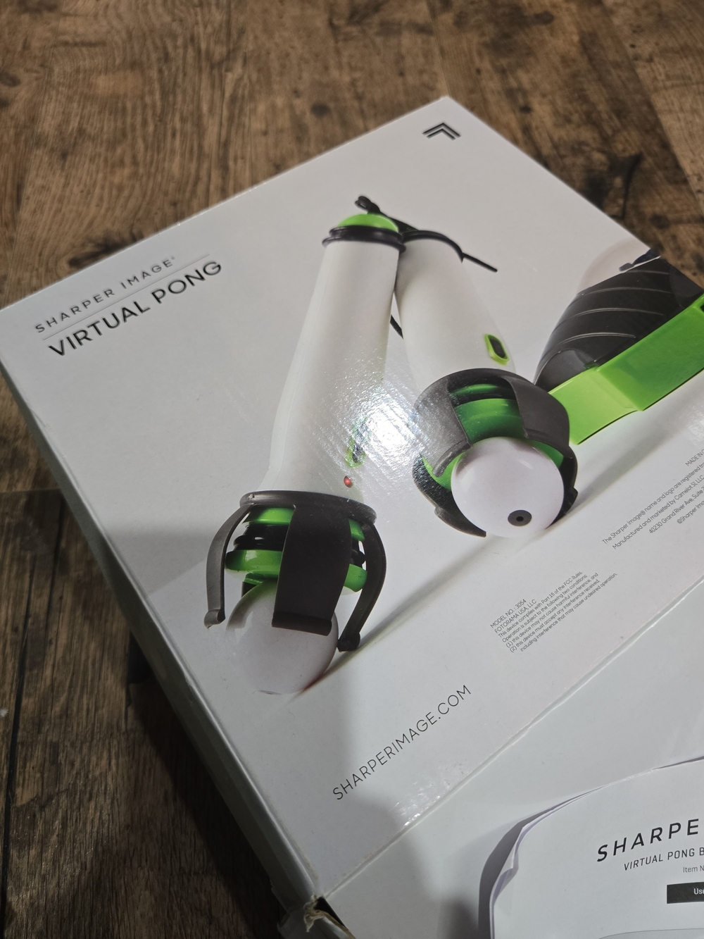 Sharper Image White and Green Virtual Pong Controllers